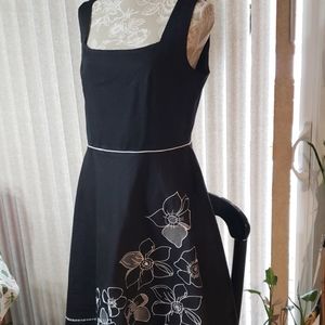 NWOT black dress with white flowers.